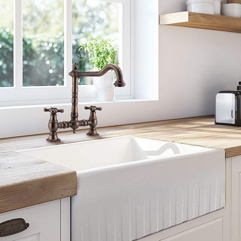 Grifo de cocina PB Nostalgic Bridge de bronce oscuro con caño acodado y manillas de estrella 1208954667